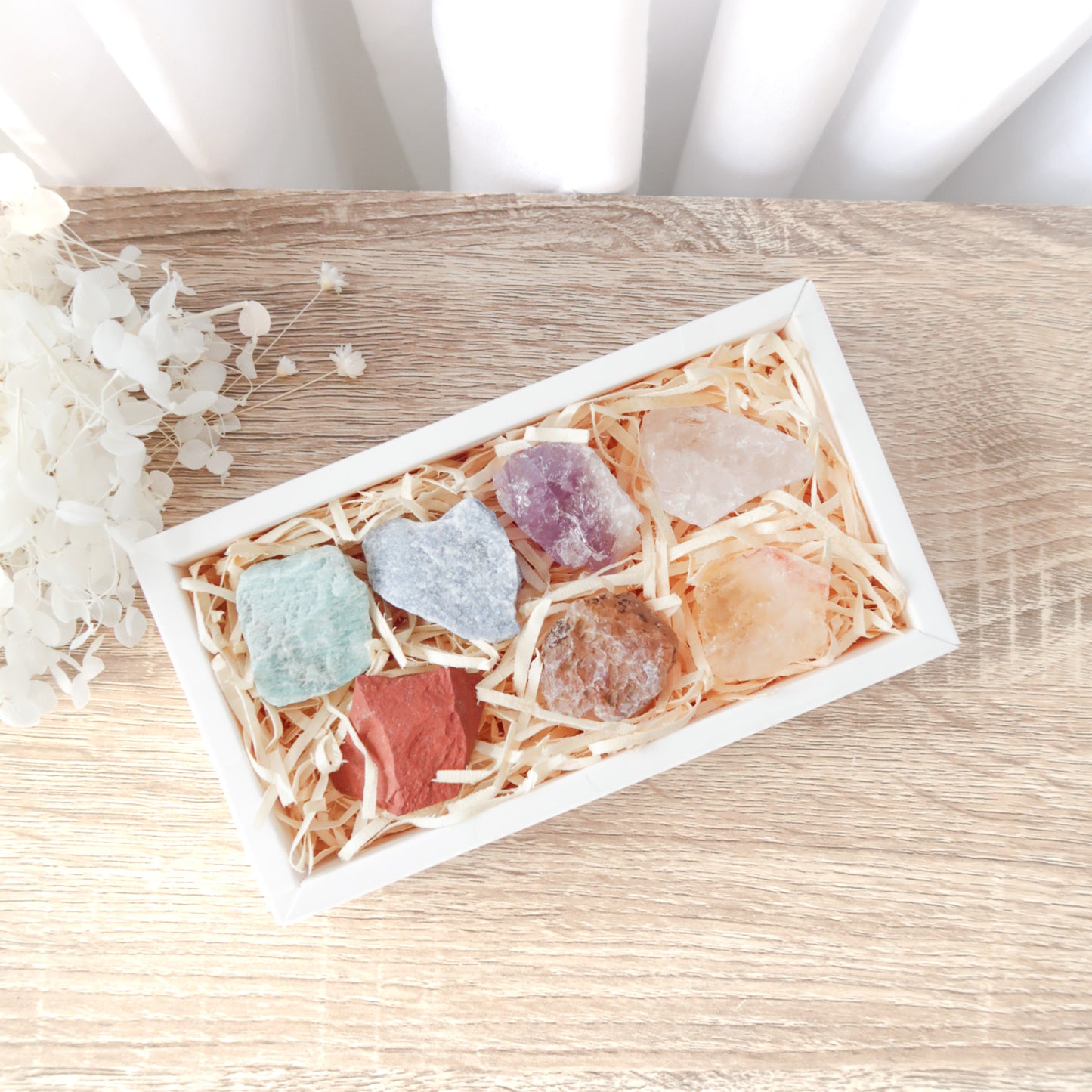 
                  
                    Desert Rose Natural Raw Chakra Coloured Rough Stones Gift Set In White Box, Wood Wool and Ribbon
                  
                