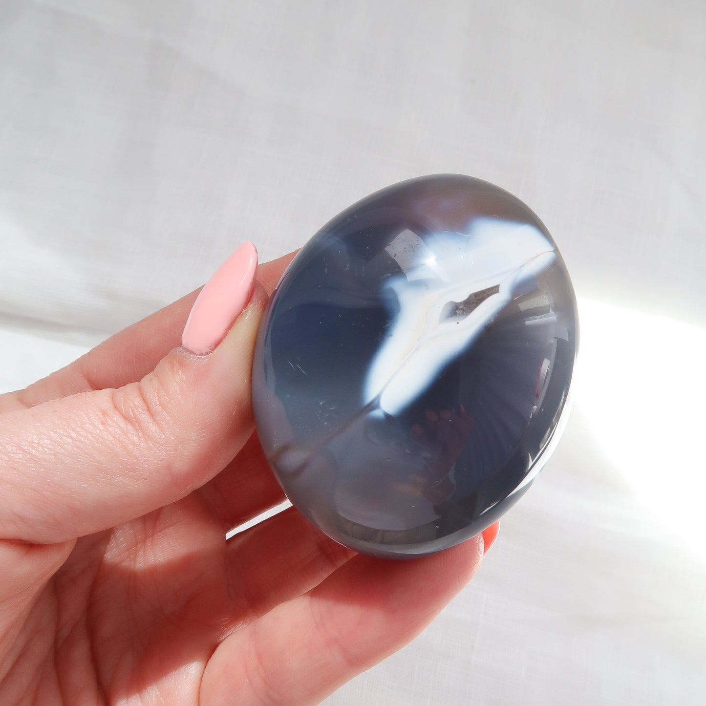 
                  
                    Natural Blue and White Agate Polished Palm Stone
                  
                