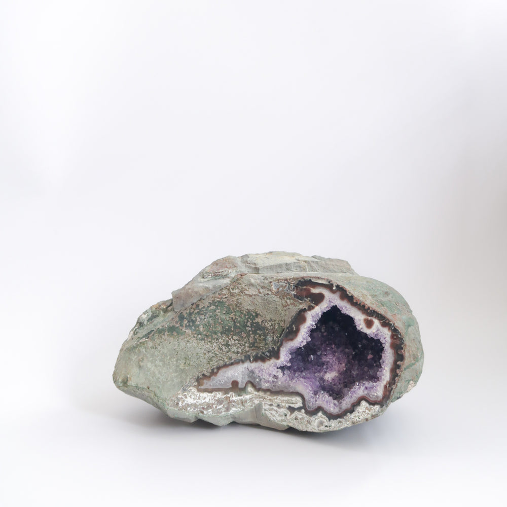 
                  
                    Large Natural and Raw Purple Amethyst Crystal Geode Right Side Opening with White Calcite Crystal Inclusion Inside
                  
                